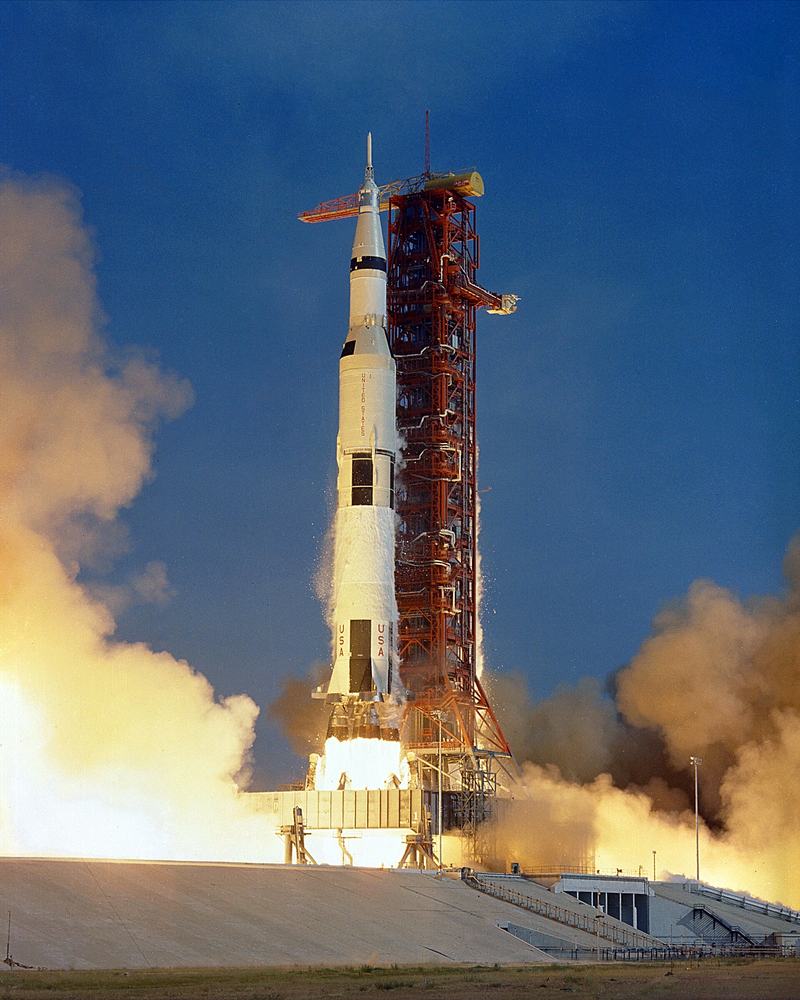 Apollo 11's Saturn V rocket lifting off from Kennedy Space Center