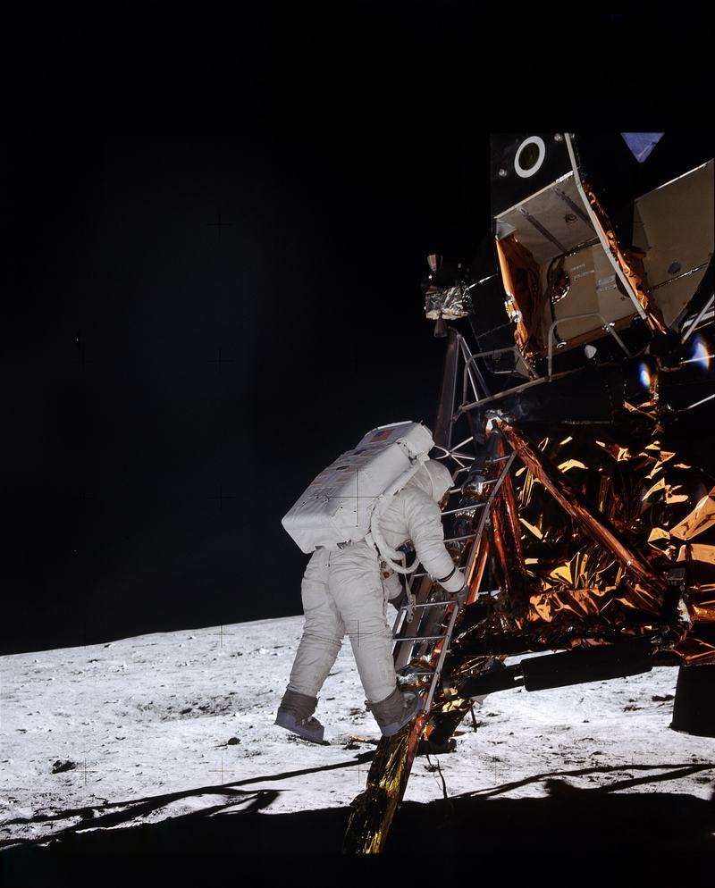 Buzz Aldrin descending the Lunar Module's ladder to the Moon's surface