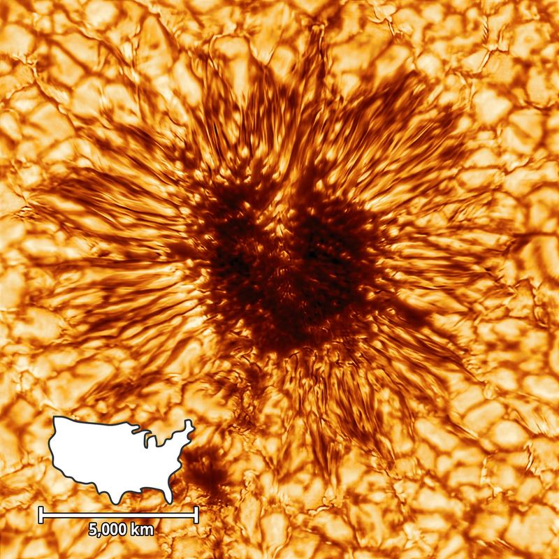 Image de télescope en gros plan d''une tache solaire montrant son ombre sombre et ses filaments structurés
