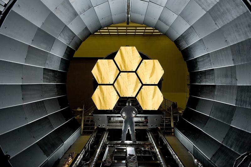 Engineer inspecting James Webb Space Telescope primary mirror segments